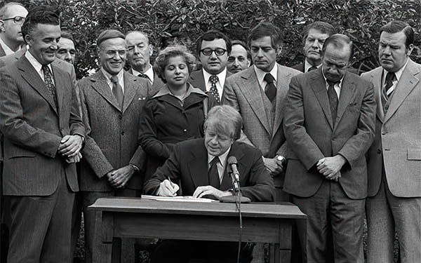 Jimmy Carter signs community reinvestment act